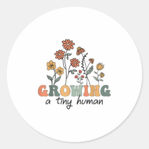 Het kweken van een kleine menselijke bloembloemen ronde sticker