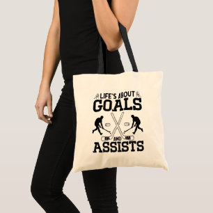 Het leven gaat over doelen en helpt hockeyliefhebb tote bag
