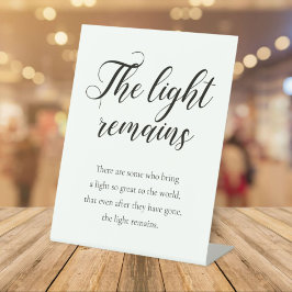 Het licht blijft een handschrift voor herdenking. reclamebord met voetstuk