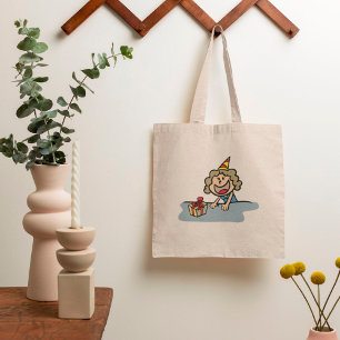 Het meisje van de verjaardag met een cadeau tote bag