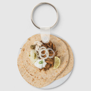 Het pitabroodje van gyroscopen met de olijven en sleutelhanger
