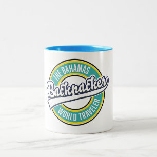 Het retro logo van de rugzakker wereldreiziger van tweekleurige koffiemok