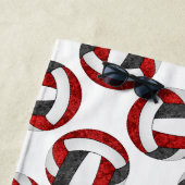 het rode zwarte volleybalteam kleuren sporters strandlaken (In situ)