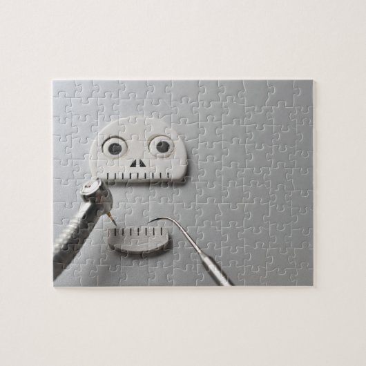 Het skelet waarvoor een tandheelkundige behandelin legpuzzel (Horizontaal)