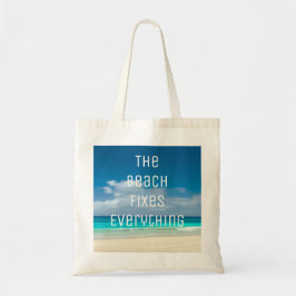 Het strand lost alles op tote bag