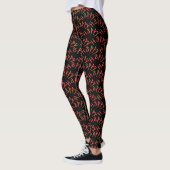 Het woord 'Happy' in het sinaasappel op Black Leggings (Links)