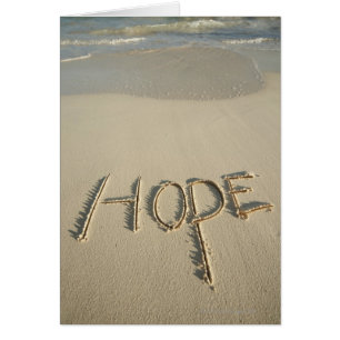Het woord 'Hope' zand geschreven op het strand met