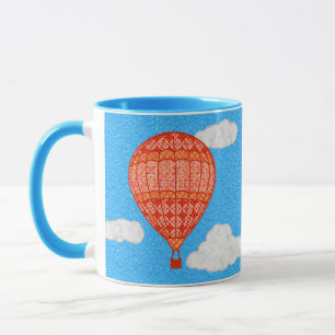 Heteluchtballon, koraaloranje tegen een blauwe luc mok