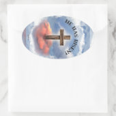 Hij heeft een ruig kruis met wolken. ovale sticker (Tas)