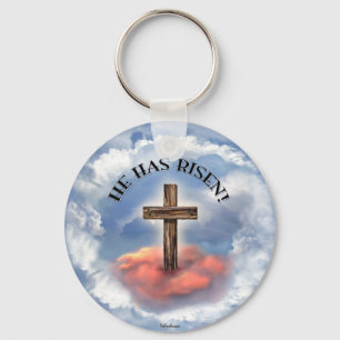 Hij heeft een ruig kruis met wolken. sleutelhanger