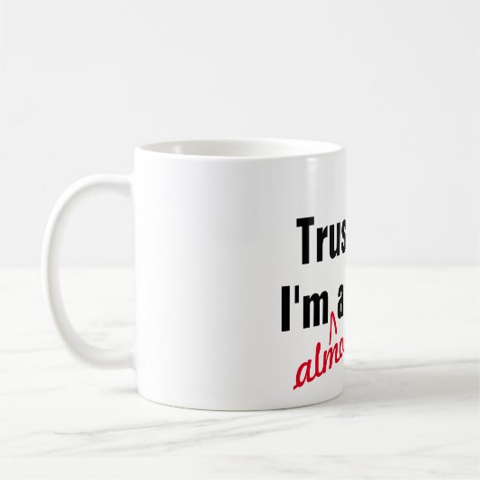 Hip vertrouwt me dat ik bijna dokter ben. koffiemok (Links)