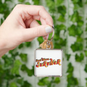 hittegolf-overlevende sleutelhanger (Hand)