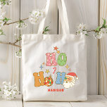 Ho Ho Groovy Vrolijk Kerstfeest Gepersonaliseerde  Tote Bag<br><div class="desc">Ho Ho Groovy Merry Christmas Personalized Name Canvas tassen bevat de kleurrijke feestelijke tekst "Ho Ho Ho" in een moderne scripttypografie met sterren,  snoep canse,  discoballen en kerstman als accenten. Gepersonaliseerd met jouw naam. Perfect voor Kerstmis en de feestdagen/ Creëer door Evco Feestdagen www.zazzle.com/store/evcoholidays</div>
