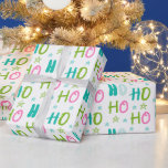 Ho Ho Ho en Stars Pastel Modern Christmas Cadeaupapier<br><div class="desc">Verfraai uw vakantie cadeau-geven met deze moderne witte kerst inpakpapier. Met een eenvoudig maar speels patroon van pastelsterren en de vrolijke woorden "Ho Ho Ho" in blauw, groen en roze, brengt dit ontwerp een frisse en leuke draai aan traditionele vakantiedrap. De heldere witte achtergrond verbetert de zachte, feestelijke kleuren en...</div>