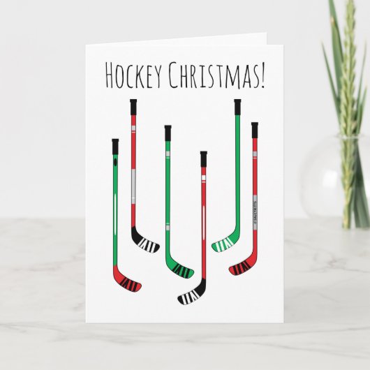 Hockey-kerstrood en groene ockey-sticks feestdagen kaart (Voorkant)
