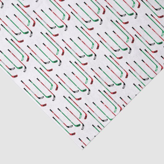 Hockey kerstrood en groene ockey sticks tissuepapier (Detail)