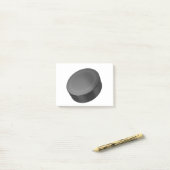 Hockey puck op white post-it® notes (Op bureau)