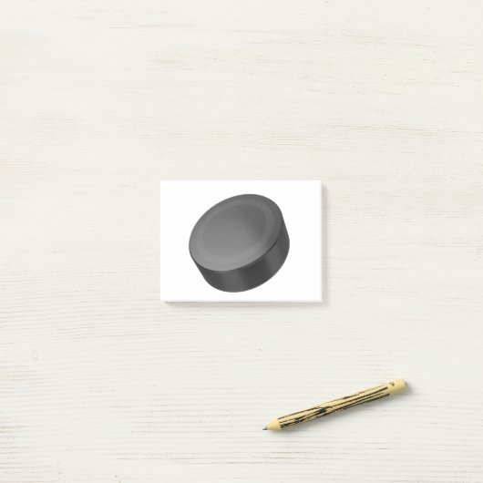 Hockey puck op white post-it® notes (Op bureau)