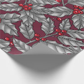 Holly berry, gray leaves on dark red cadeaupapier (Hoek)