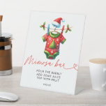 Holly Christmas Santa Baby shower Mimosa Bar Reclamebord Met Voetstuk<br><div class="desc">Zet een feestelijke toon met onze Holly Christmas Santa Baby shower Mimosa Bar Sign. Met een vrolijk Santa Claus-ontwerp omgeven door hulst en wintergroen, voegt dit bord een vleugje vakantiemagie toe aan uw mimosa-bar. Het is ideaal voor het begeleiden van gasten naar dit prachtige drink station, het verbeteren van de...</div>