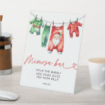 Holly Christmas Santa Baby shower Mimosa Bar Reclamebord Met Voetstuk<br><div class="desc">Zet een feestelijke toon met onze Holly Christmas Santa Baby shower Mimosa Bar Sign. Met een vrolijk Santa Claus-ontwerp omgeven door hulst en wintergroen, voegt dit bord een vleugje vakantiemagie toe aan uw mimosa-bar. Het is ideaal voor het begeleiden van gasten naar dit prachtige drink station, het verbeteren van de...</div>