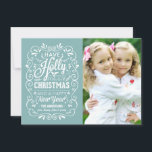 Holly Jolly Christmas Winter Blue Photo Card Feestdagenkaart<br><div class="desc">Festive and folksy curly chalk-art style Christmas Holiday greetings foto template on trendy flat cards. Whimsical chalkboard style white typography on cheerful winter blue background with retro mix of hand-lettered styles, decorated with frosty folio and holly berries. Add your favorite fotofamilie and customize the text. Modern way to send happy...</div>