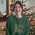 Holly Jolly Green Merry Christmas lange mouw T-shirt<br><div class="desc">Stap in de kerstsfeer met deze vrolijke vrouwen lange mouw top. Met een gedurfde "Holly Jolly" grafische print is dit gezellige, comfortabele shirt de perfecte manier om uw liefde voor het vakantieseizoen te laten zien. Gemaakt van een zacht, elastisch katoenmengsel, biedt dit t-shirt met lange mouwen een ontspannen, flatterende pasvorm...</div>
