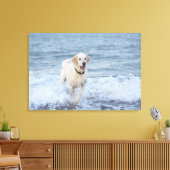 Hond loopt in water op het strand. canvas afdruk (Insitu (Woonkamer))