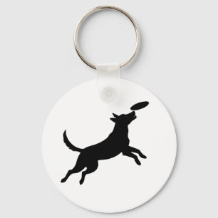 hond springt om een frisbee te vangen sleutelhanger