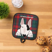 Hond wil zijn deel van het bakken traktaties pannenlap (Top down)