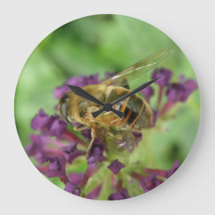 Honingbij en paarse bloemen wandklok