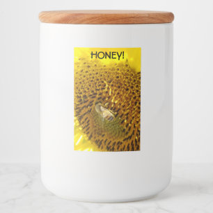 Honingbijen op een zonnebloem voedselcontainer etiket
