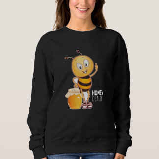 Honinghandelaar in bijen trui