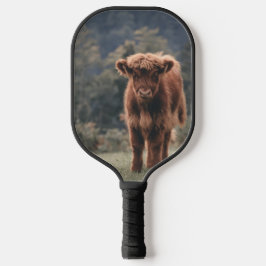 Hoogland koe kalf herfstgrasveld pickleball paddle