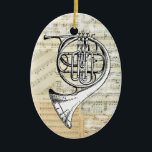 horn Music Ornament<br><div class="desc">Een  Franse Hoorn is geplaatst tegen een achtergrond van  muziek om deze mooie sieraad te maken,  perfect voor een muzikant of muziekliefhebber. De rug is leeg voor een naam,  een datum of een ander bericht. Andere  muziekobjecten en design zijn beschikbaar in mijn Zazzle winkel.</div>