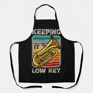 Houdend het lage zeer belangrijke instrument tuba schort