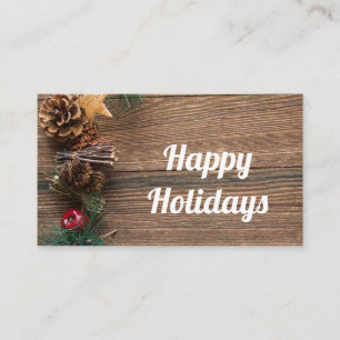 houten achtergrond met dennenappels     visitekaartje