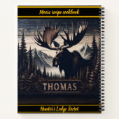 Houten snijwerk van een eland staat trots notitieboek (Achterkant)