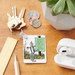 Houten Tinman leest bord langs de gele bakstenen w Sleutelhanger