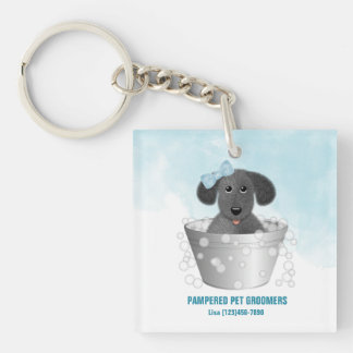 Huisdier groomer puppy in bad sleutelhanger