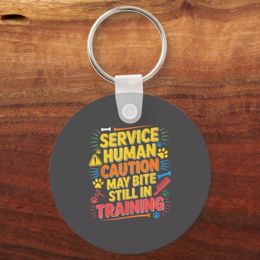 Human Caution Service May Still Bite Training Smil Sleutelhanger (Voorkant)
