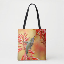 Hummingbird omringd door rode yucca tote bag