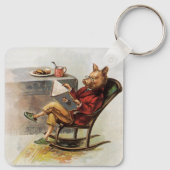 Humor, drager in Rocking-stoel Een boek lezen Sleutelhanger (Achterkant)