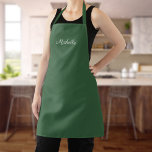 Hunter Green-Schort met aangepaste naam Michelle Schort<br><div class="desc">Cook in stijl met dit gepersonaliseerde jager groene schort met uw douanenaam die in een elegant wit krommend manuscript over het borstelgebied wordt gedrukt! Dit schort is duurzaam en een praktische aanvulling op je keuken. Het elegante cursieve manuscript voegt een aanraking van verfijning aan het schort toe, makend tot het...</div>