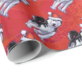 Husky in Santa Hat op Red Cadeaupapier (Rol Hoek)