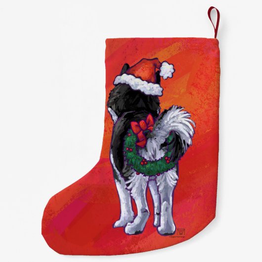 Husky in Santa Hat op Red Kleine Kerstsok (Achterkant)