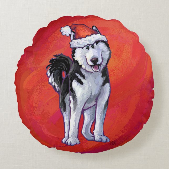 Husky met kerstmuts op rood rond kussen (Voorkant)