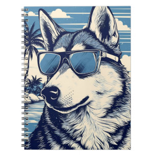 Husky met zonnebril op het strand notitieboek
