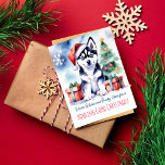 Husky puppy kerst groeten hond mensen briefkaart<br><div class="desc">Siberische Husky puppy Vrolijk kerstgroet briefkaart voor hondenmensen,  waterverf schattige Husky puppy door geschenkdozen en kerstboom,  kerst briefkaart voor hondenliefhebbers</div>