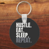HUSTLE.EAT.SLEEP. HERHAAL. SLEUTELHANGER (Voorkant)